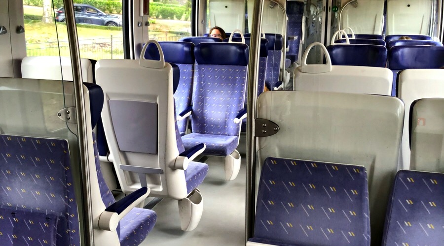 The seating inside of a train running from the Gare de Tours.