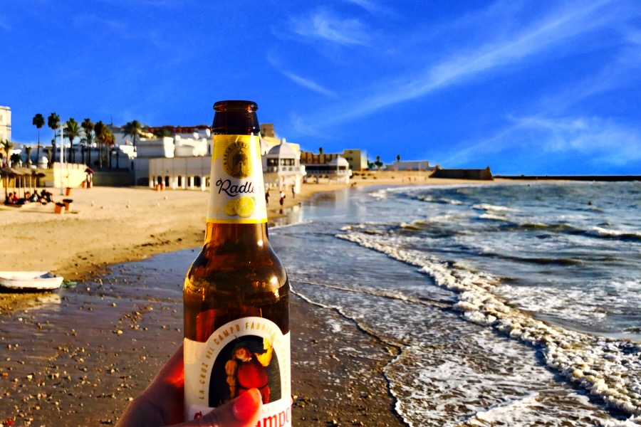 Drink a Cruzcampo at one of the casual bars in Cadiz, Glacial.