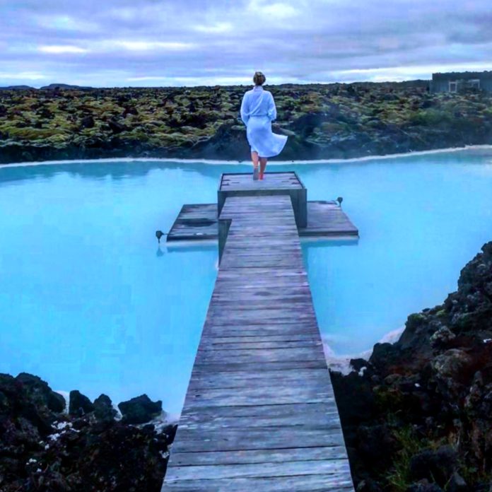 A female walks near the private Lagoon at the Silica Hotel in Iceland.
